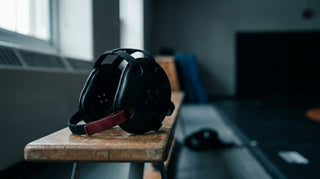 Cauliflower ear care: clean wrestling headgear resting on a bench