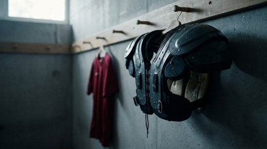 Rugby shoulder pads hanging in a changing room - how to safely clean body armour with non-removable foam
