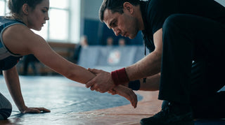 IBJJF skin check: a competitor presenting a clean forearm mat-side at a tournament