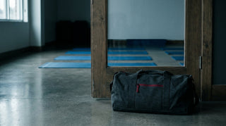 When to stay off the mats: a packed gym bag resting by the door