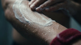 Close-up of creamy non-stripping soap lather on a forearm