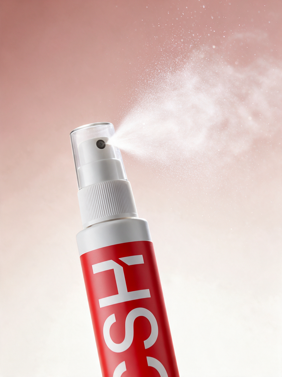 Full Guard face spray releasing a fine mist against a soft pink background